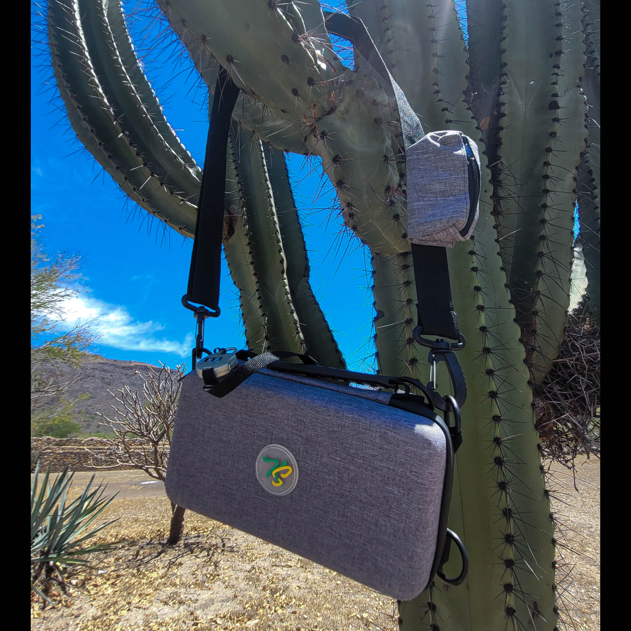 Travel Pouch – Lockable and smell proof hard shell carry-on bag - Hard case with with an adjustable shoulder lace with a small pocket on it